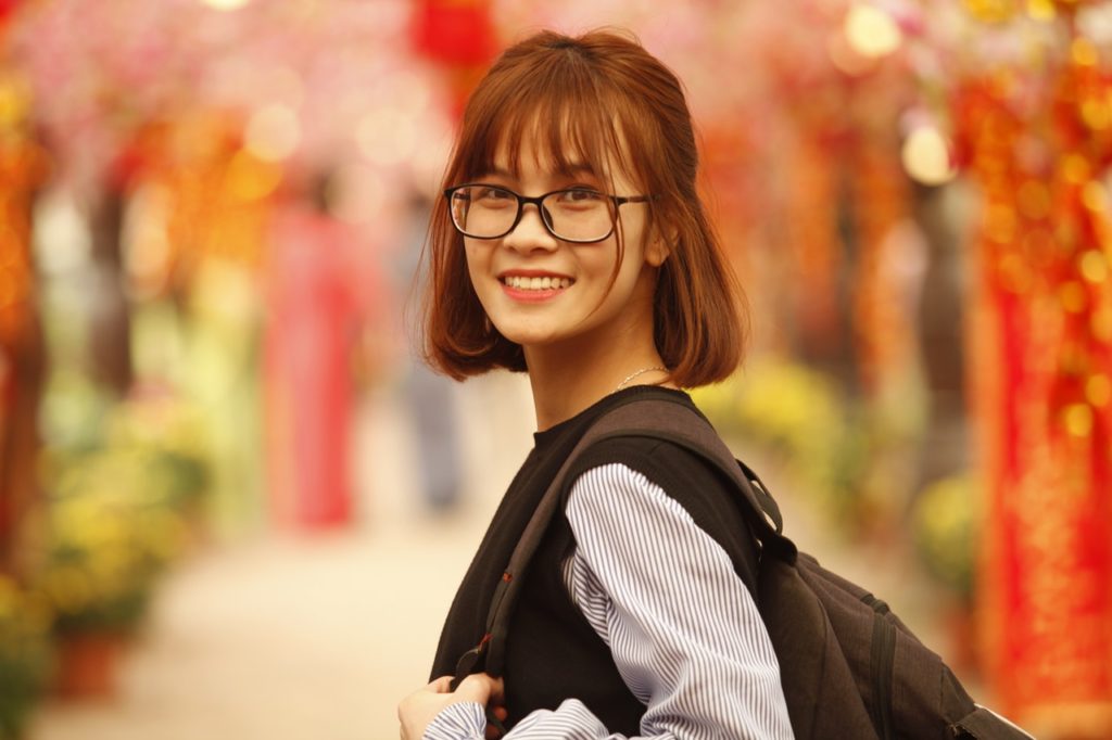 Smiling Studious Young Woman with Backpack_female